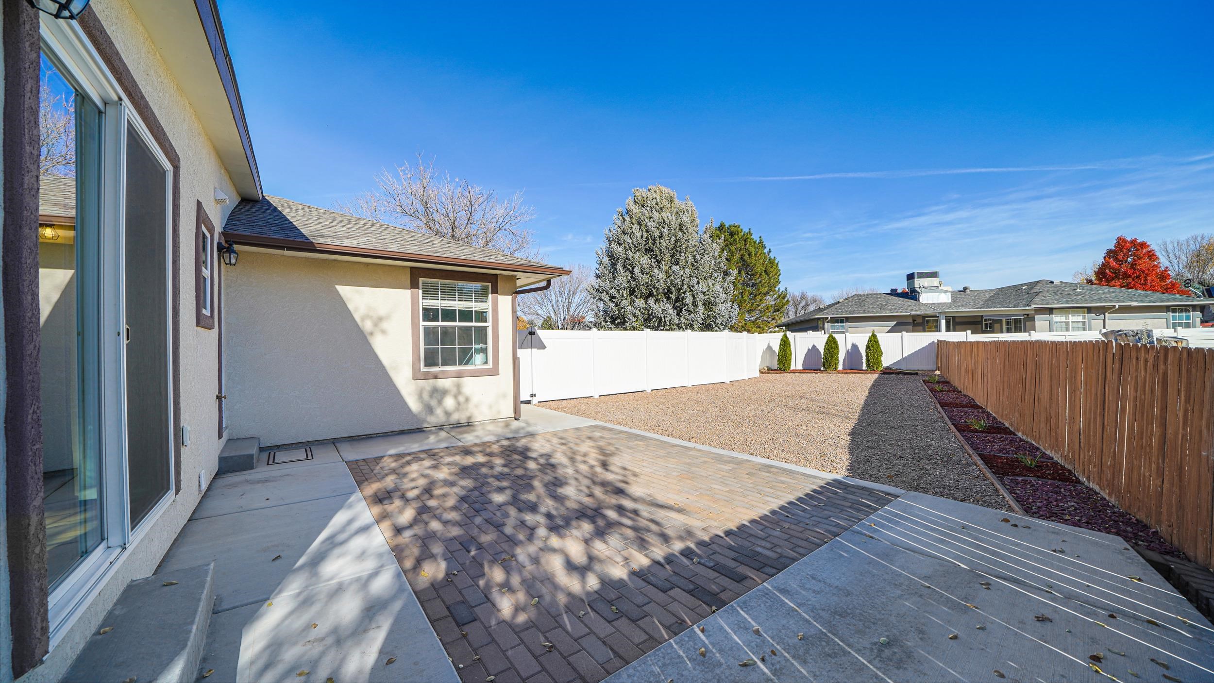 1631 Ptarmigan Ridge Court Grand Junction, CO 81506 - Photo 30 of 33 a view of a house with a backyard