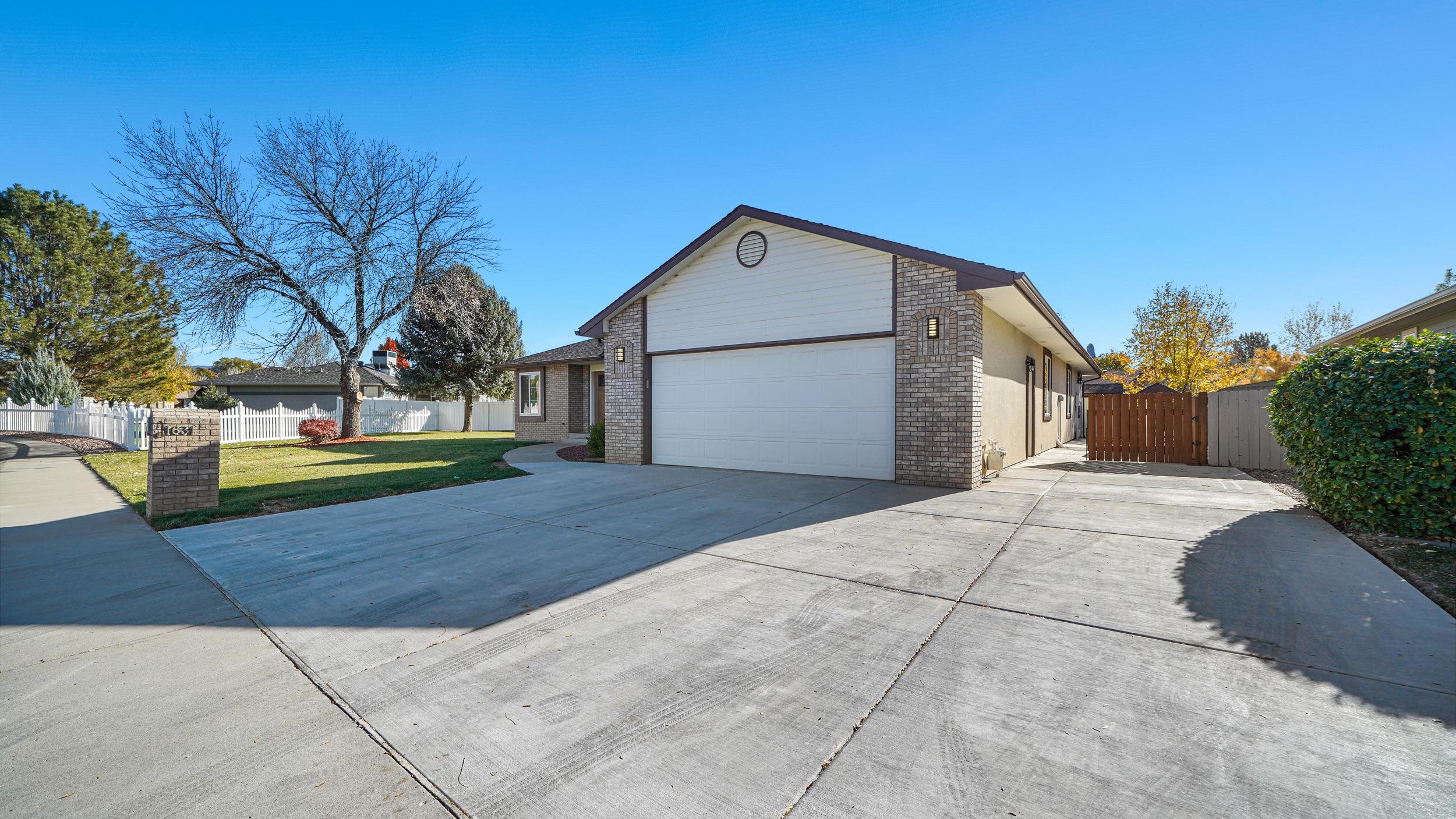 1631 Ptarmigan Ridge Court Grand Junction, CO 81506 - Photo 3 of 33 a house view with a outdoor space