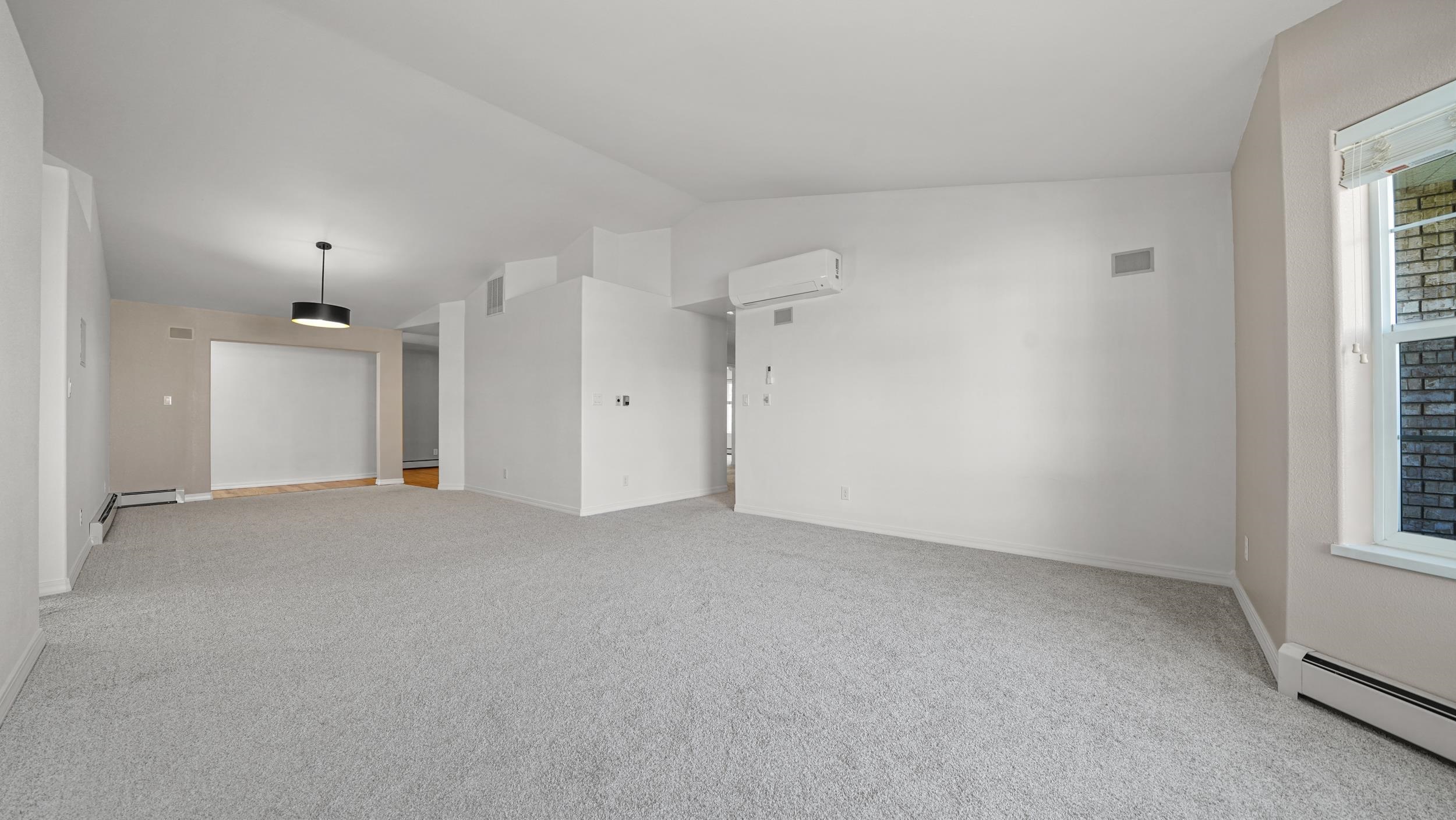 1631 Ptarmigan Ridge Court Grand Junction, CO 81506 - Photo 6 of 33 an empty room with windows and closet