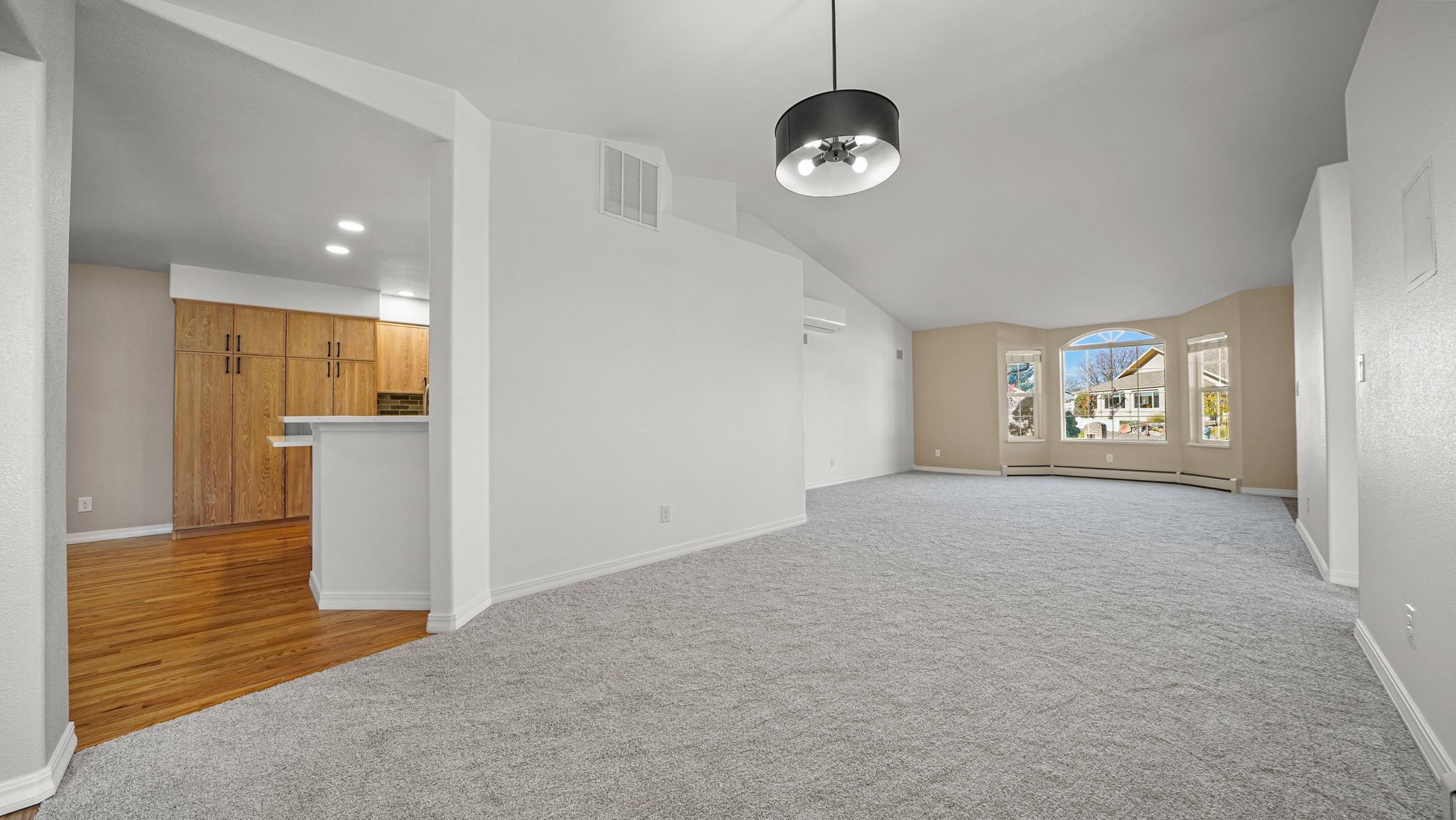1631 Ptarmigan Ridge Court Grand Junction, CO 81506 - Photo 7 of 33 a view of an empty room and a kitchen