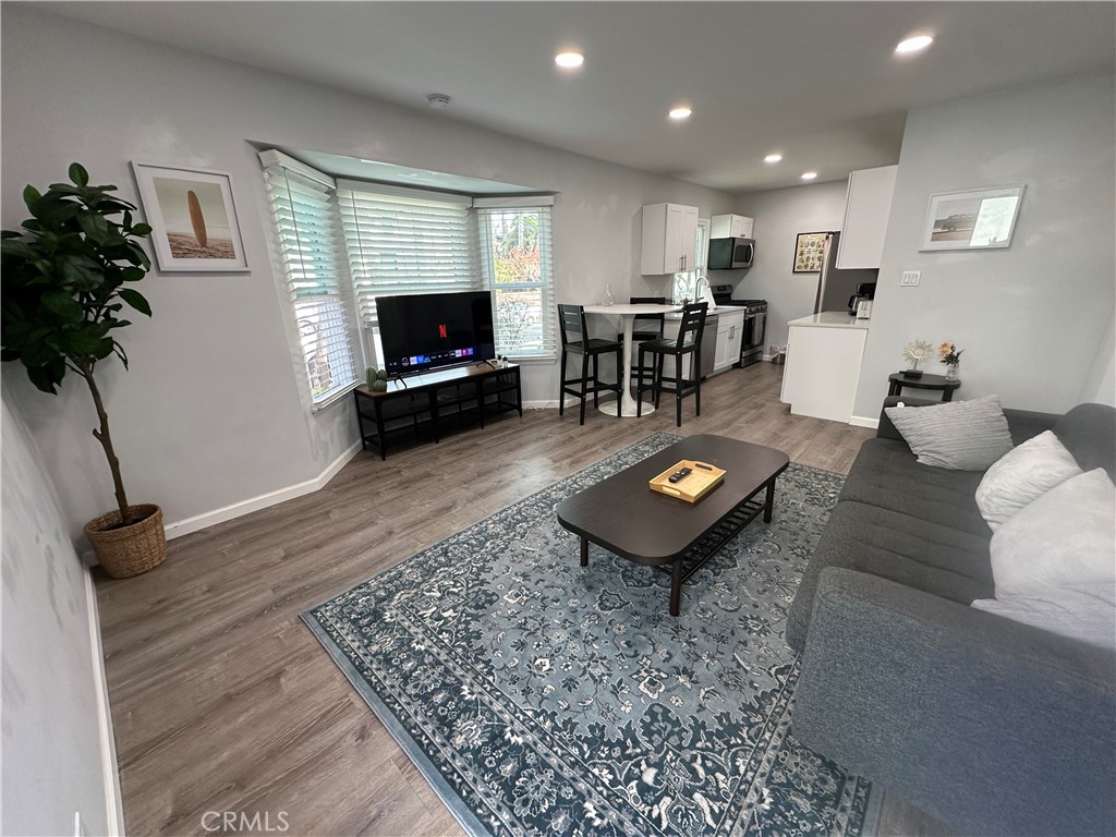 239 3rd Avenue Venice, CA 90291 - Photo 1 of 10 a living room with furniture and a flat screen tv
