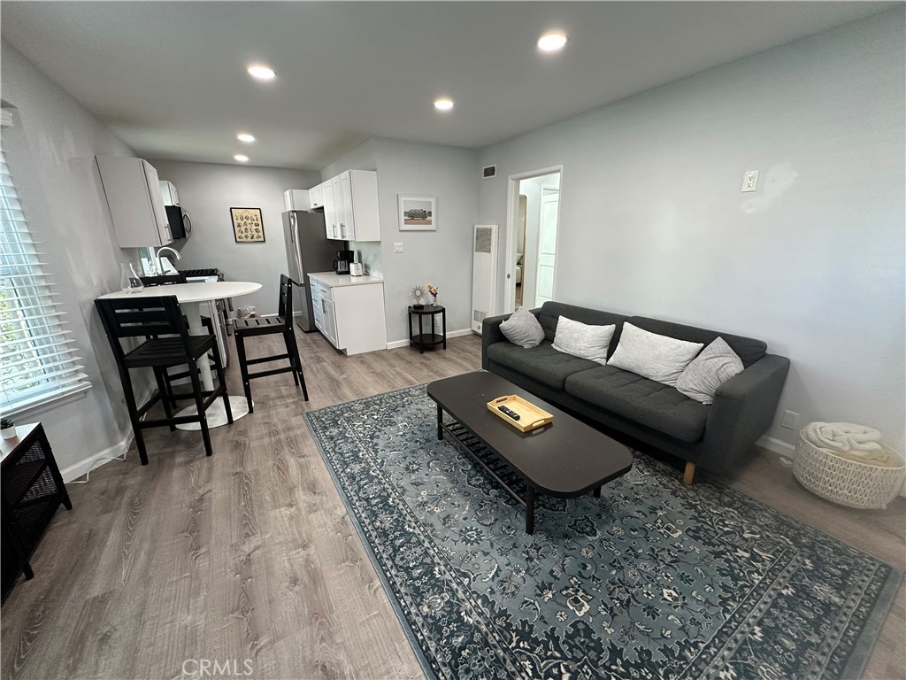 239 3rd Avenue Venice, CA 90291 - Photo 10 of 10 a living room with furniture and wooden floor