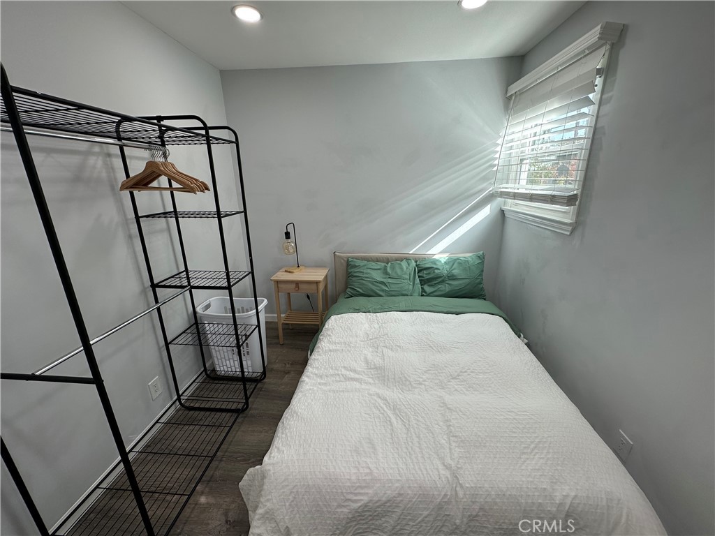 239 3rd Avenue Venice, CA 90291 - Photo 7 of 10 a bedroom with a white bed and a window
