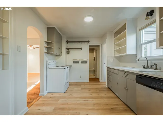 a kitchen with a sink and refrigerator