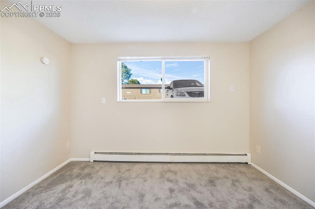 6610 Dublin Loop West, Unit 2 Colorado Springs, CO 80918 - Photo 17 of 50 a view of an empty room with a window