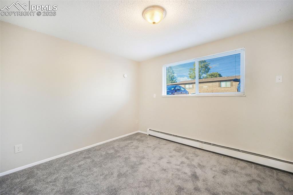 6610 Dublin Loop West, Unit 2 Colorado Springs, CO 80918 - Photo 20 of 50 an empty room with a window