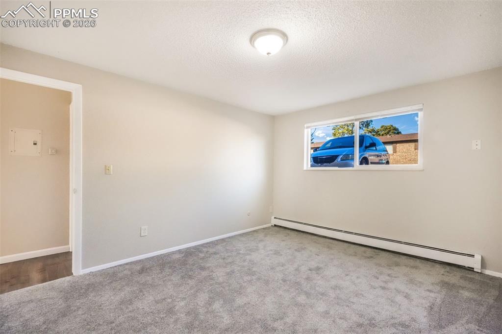 6610 Dublin Loop West, Unit 2 Colorado Springs, CO 80918 - Photo 23 of 50 an empty room with windows