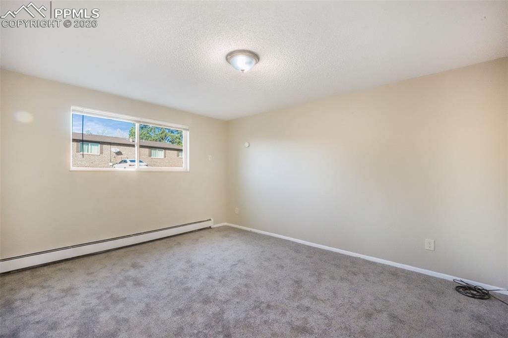 6610 Dublin Loop West, Unit 2 Colorado Springs, CO 80918 - Photo 24 of 50 an empty room with windows