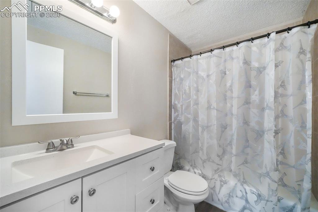 6610 Dublin Loop West, Unit 2 Colorado Springs, CO 80918 - Photo 25 of 50 a bathroom with a sink and a mirror