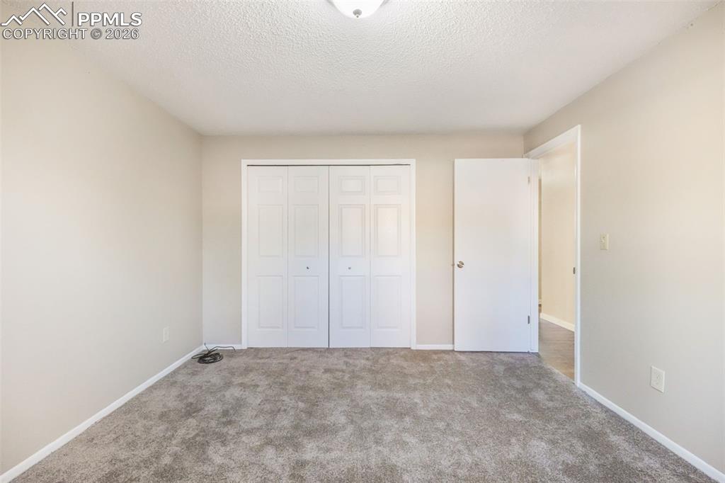 6610 Dublin Loop West, Unit 2 Colorado Springs, CO 80918 - Photo 30 of 50 a view of an empty room and entryway
