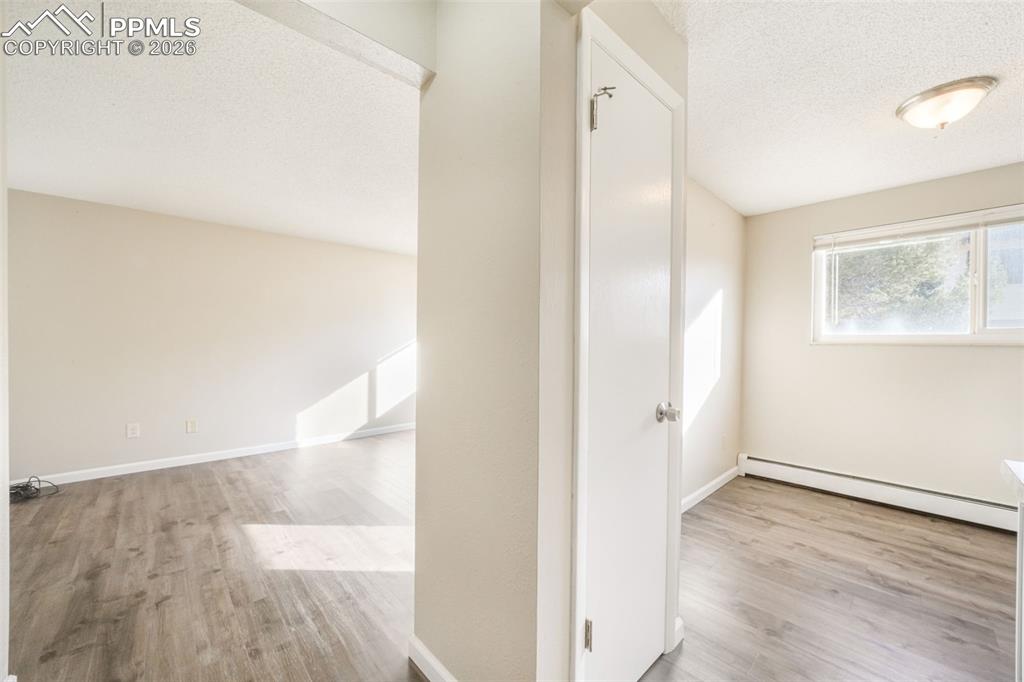 6610 Dublin Loop West, Unit 2 Colorado Springs, CO 80918 - Photo 3 of 50 a view of a hallway with wooden floor and entryway