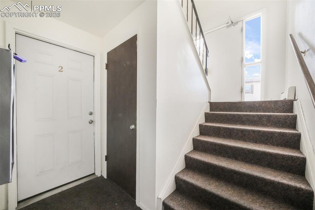 6610 Dublin Loop West, Unit 2 Colorado Springs, CO 80918 - Photo 39 of 50 a view of entryway with wooden floor