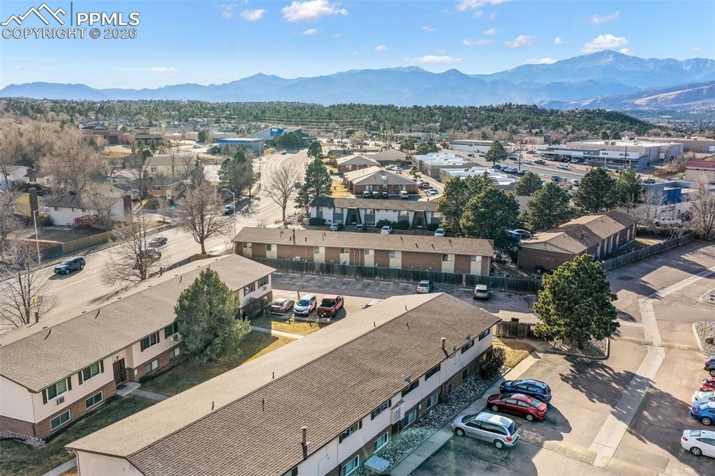 6610 Dublin Loop West, Unit 2 Colorado Springs, CO 80918 - Photo 49 of 50 an aerial view of residential houses with outdoor space and ocean view