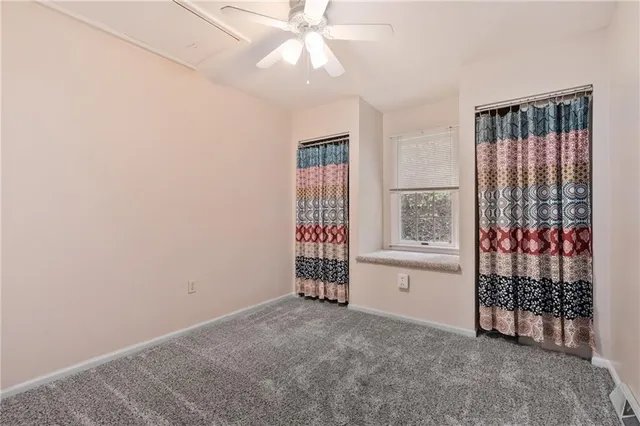 a white toilet sitting next to a bathroom sink