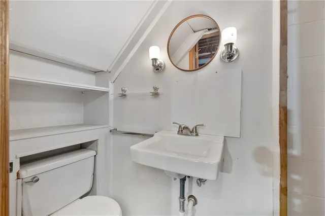 a room with wooden floor and furniture