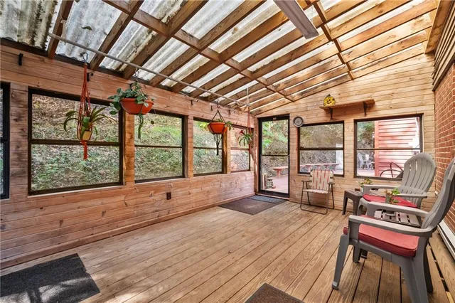 a view of a chairs and table on the deck
