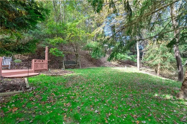 an outdoor space with patio lots of furniture and umbrella