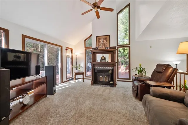 a view of a livingroom with furniture and staircase