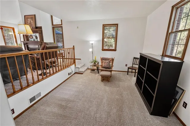 a kitchen with a stove sink and cabinets