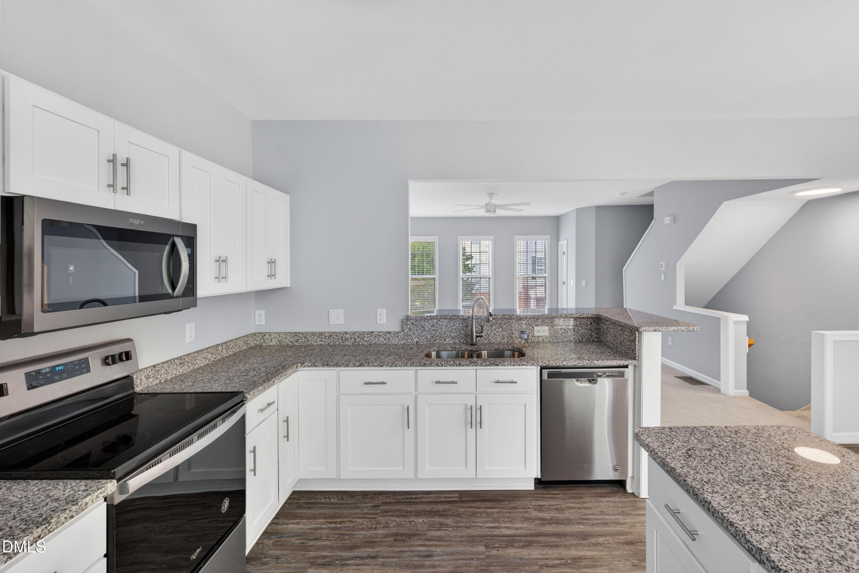 5421 Golden Arrow Lane Raleigh, NC 27613 - Photo 22 of 49 a kitchen with stainless steel appliances granite countertop a sink and stove top oven
