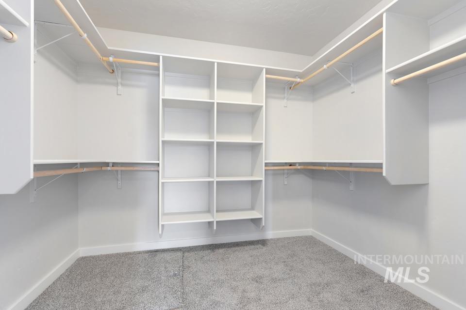 1340 Dawn Street Weiser, ID 83672 - Photo 19 of 32 Walk in closet featuring light carpet