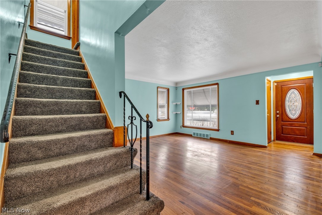 5731 Dunham Road Maple Heights, OH 44137 - Photo 4 of 28 Entryway featuring hardwood / wood-style floors