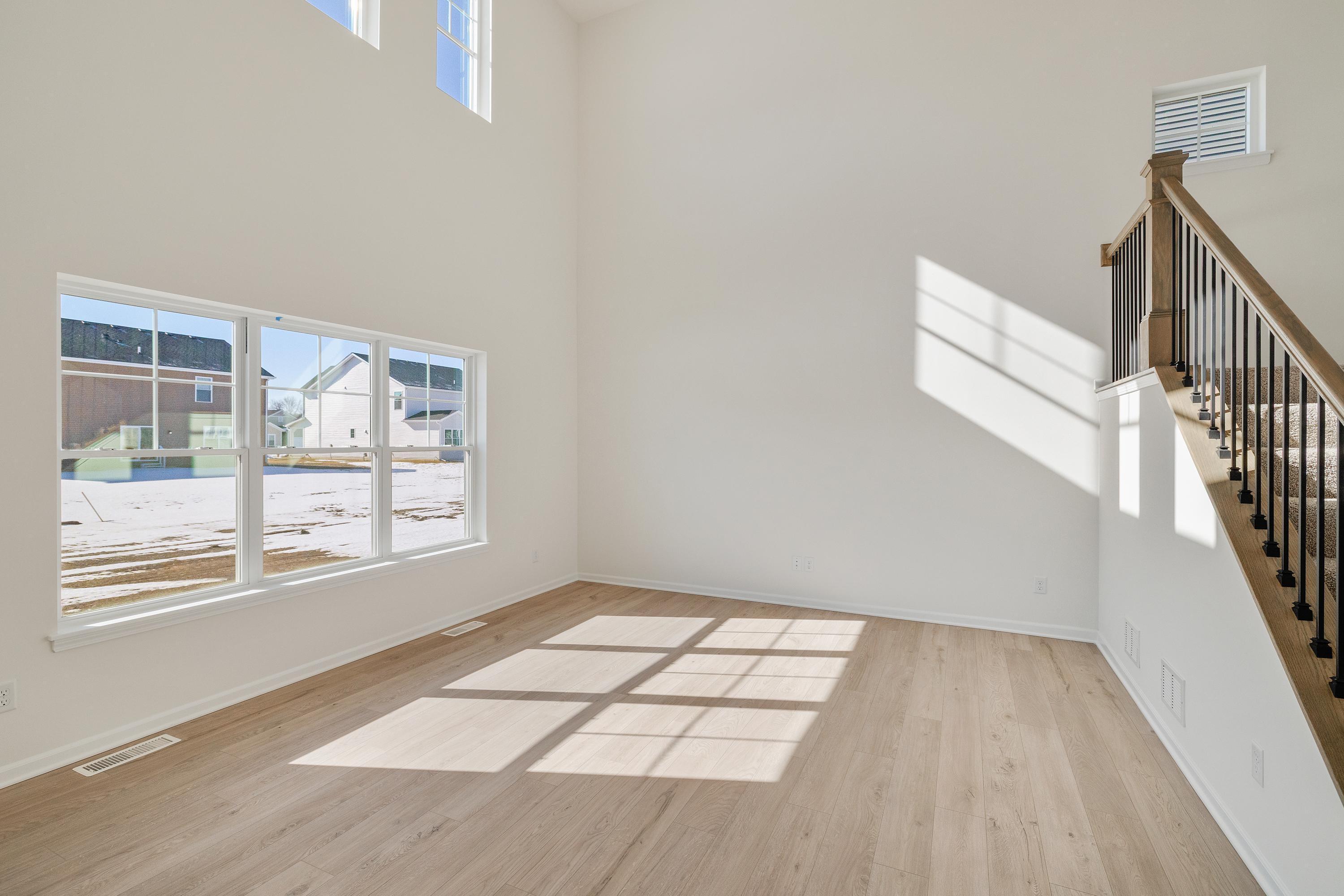 545 East 130th Place Crown Point, IN 46307 - Photo 15 of 25 a view of an empty room with wooden floor and a window