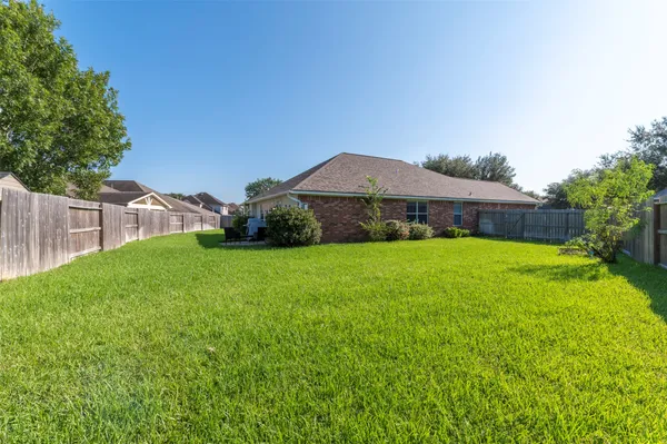 a view of a house with a back yard