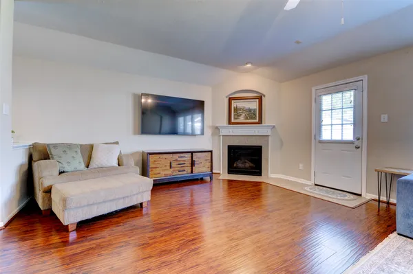 a spacious bedroom with a bed and a flat screen tv