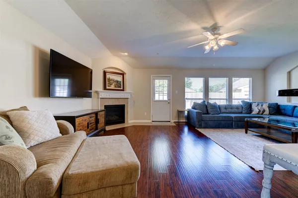 a bedroom with furniture and a fireplace