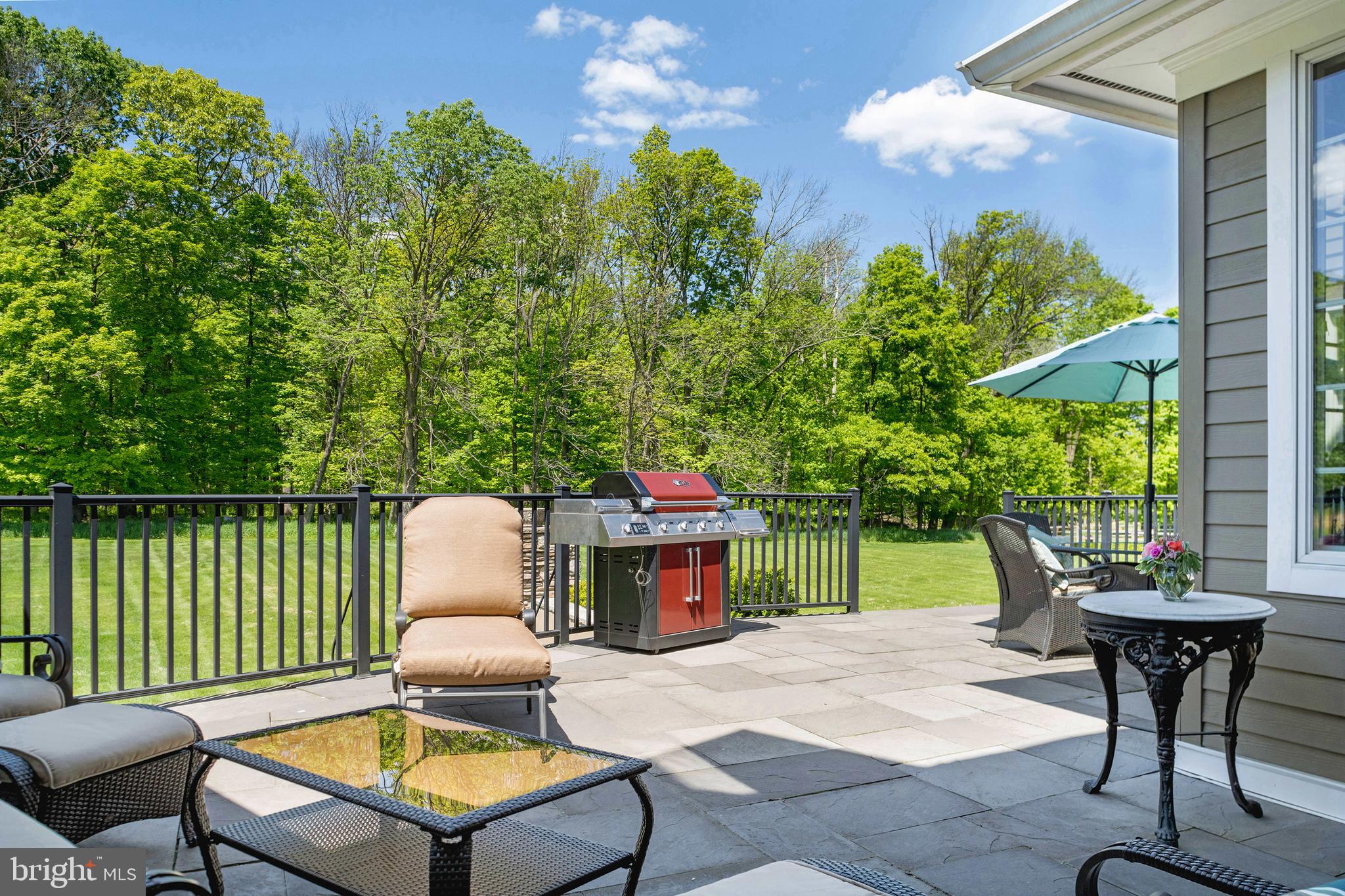 50 Dunkard Church Road Stockton, NJ 08559 - Photo 14 of 51 a backyard of a house with table and chairs