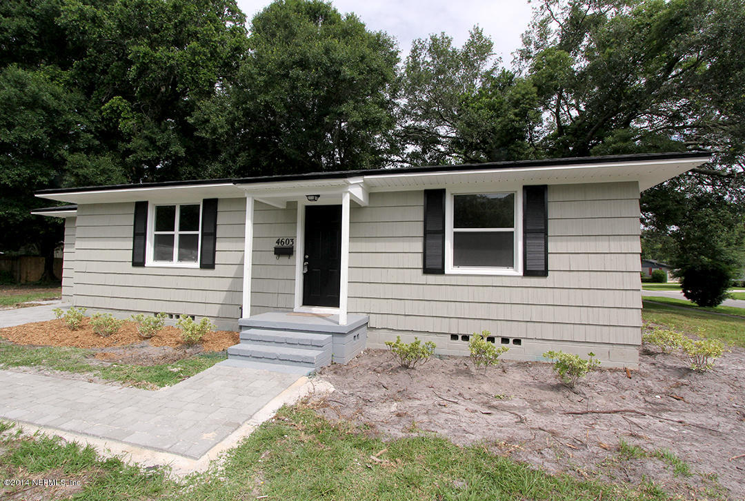 4603 Homestead Road Jacksonville, FL 32210 - Photo 3 of 15 a front view of a house with garden