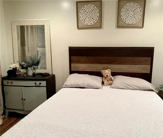 a bathroom with double vanity sink and mirror