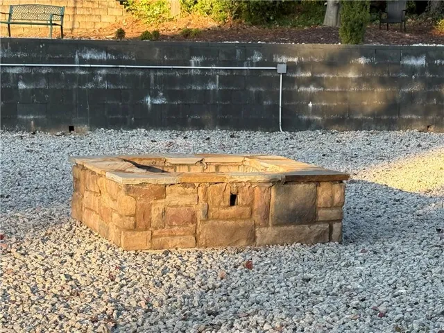 a view of a swimming pool with a table and chairs