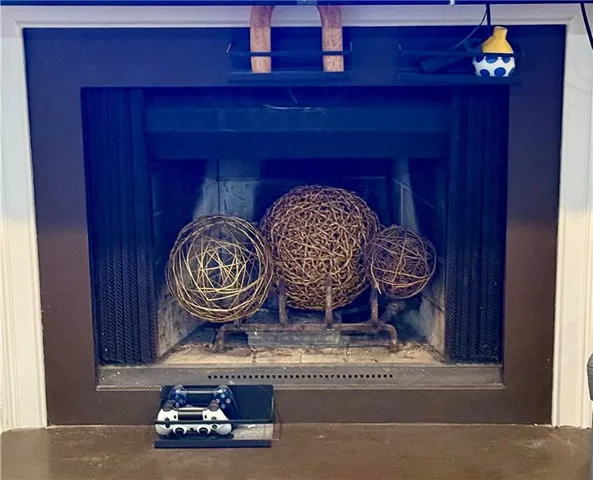 a table with a clock on it and wooden door