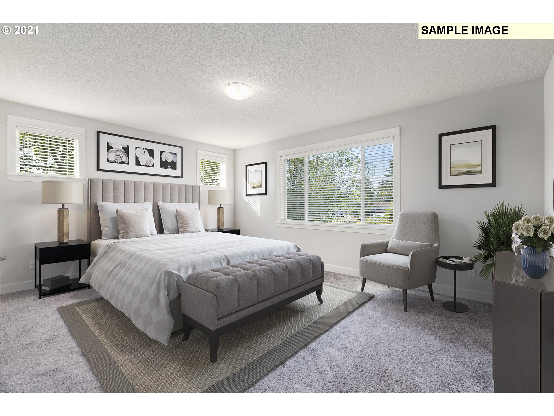 1715 Northeast Hancock Road Camas, WA 98607 - Photo 10 of 14 a spacious bedroom with a bed a couch and a window
