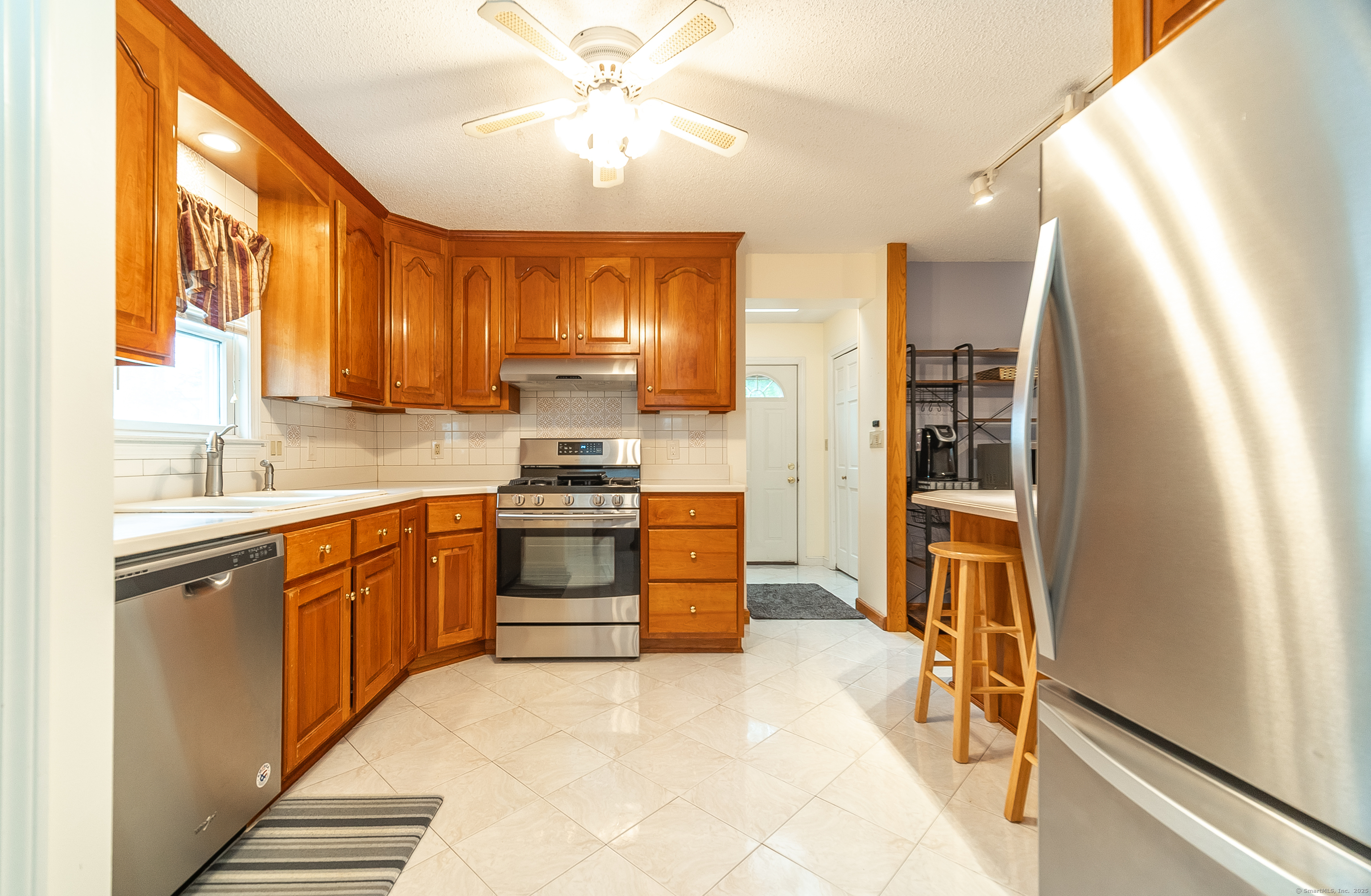 18 Ingram Street Hamden, CT 06517 - Photo 12 of 39 a kitchen with stainless steel appliances a stove sink and refrigerator