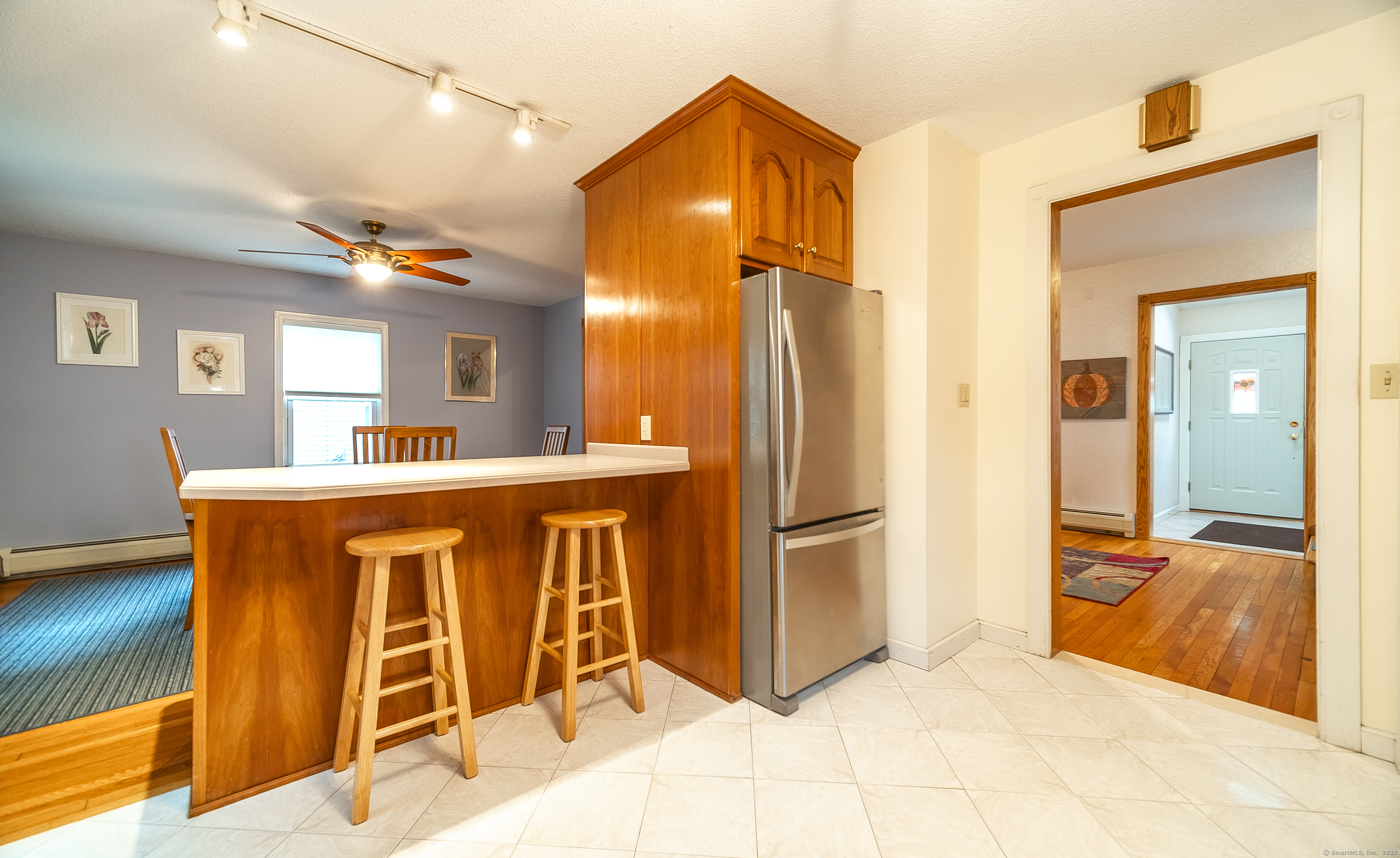 18 Ingram Street Hamden, CT 06517 - Photo 15 of 39 a view of kitchen with stainless steel appliances kitchen island granite countertop dining table chair and a refrigerator