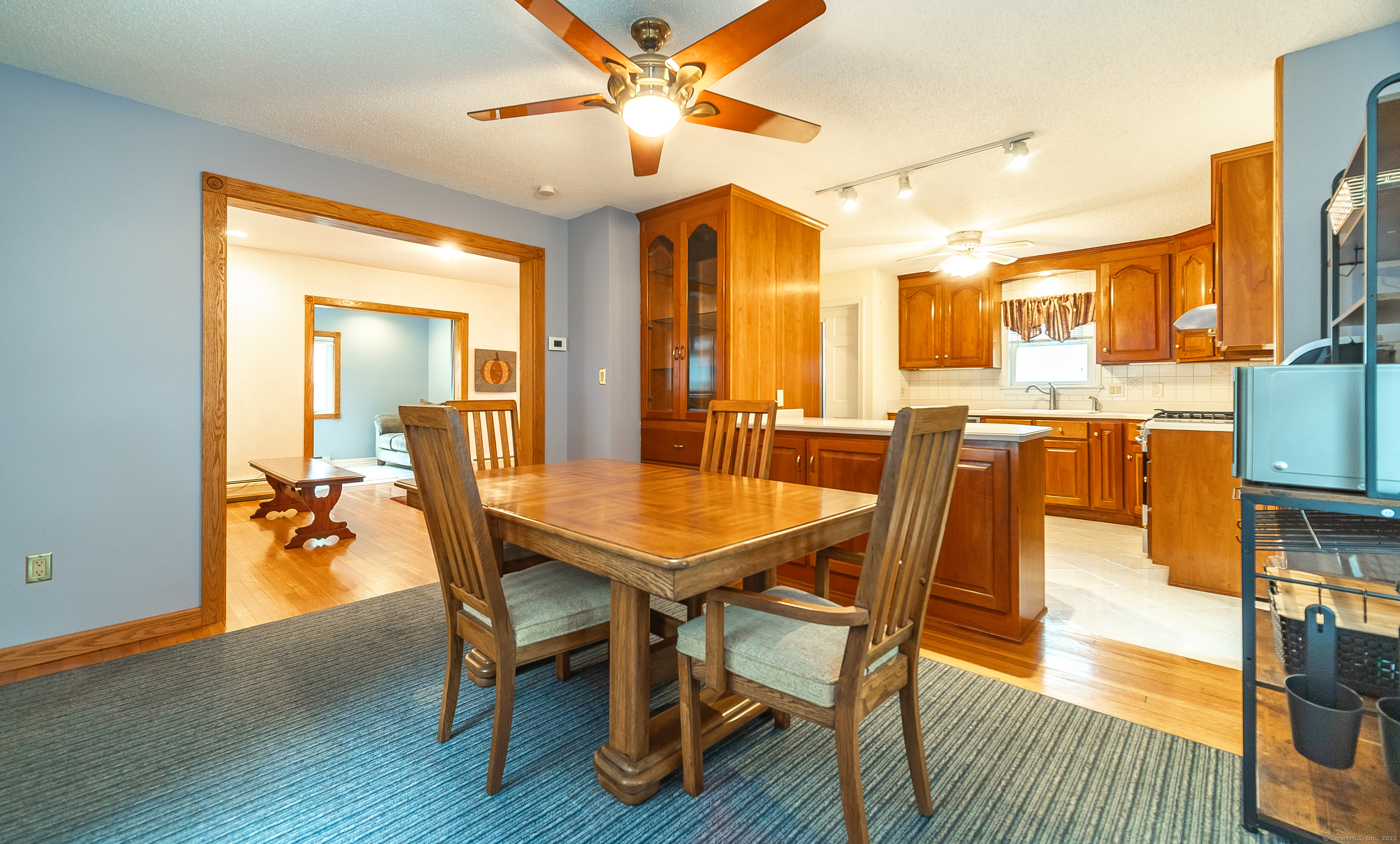 18 Ingram Street Hamden, CT 06517 - Photo 18 of 39 a dining room with furniture a chandelier and wooden floor