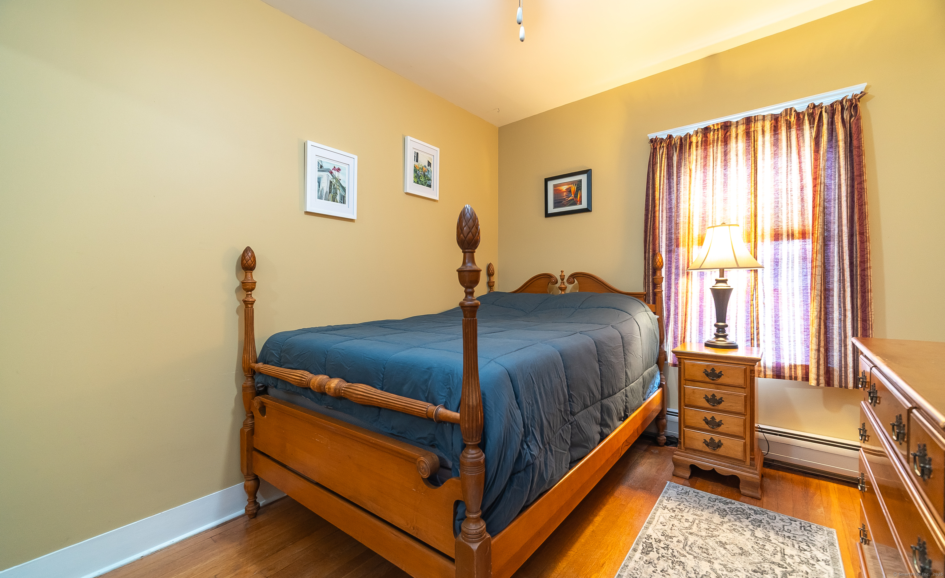 18 Ingram Street Hamden, CT 06517 - Photo 30 of 39 a bed sitting in a bedroom next to a window