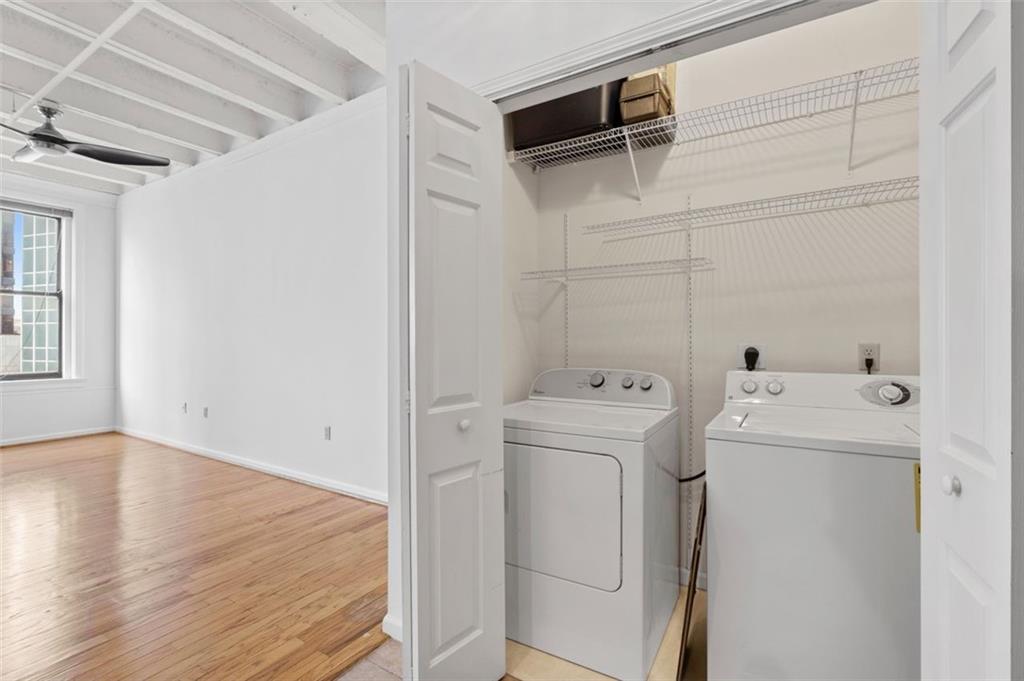 32 Peachtree Street Northwest, Unit 804 Atlanta, GA 30303 - Photo 12 of 40 a view of a storage & utility room with dryer and washer