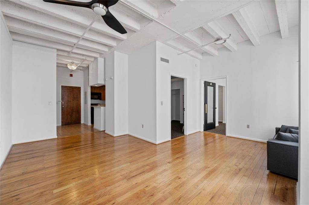 32 Peachtree Street Northwest, Unit 804 Atlanta, GA 30303 - Photo 15 of 40 a view of an empty room with wooden floor