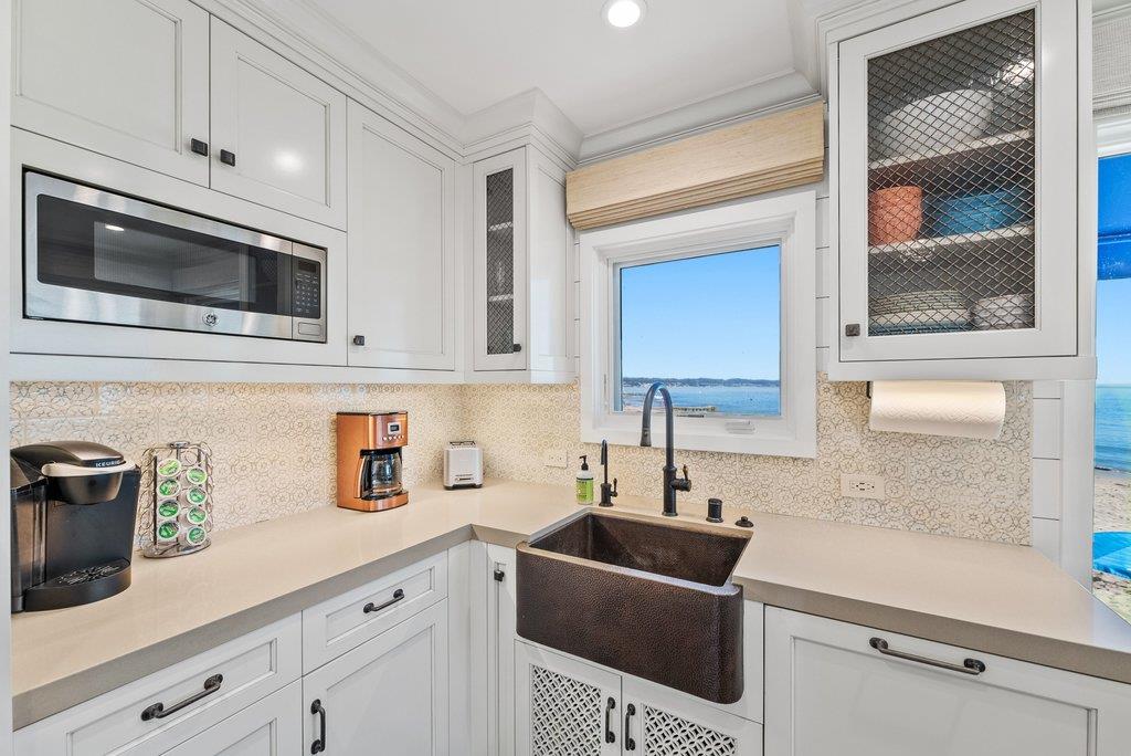 1500 Wharf Road, Unit 22 Capitola, CA 95010 - Photo 21 of 48 a kitchen with stainless steel appliances a sink a stove a microwave and cabinets