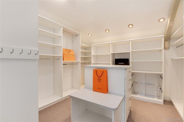 a view of an empty room with empty shelves