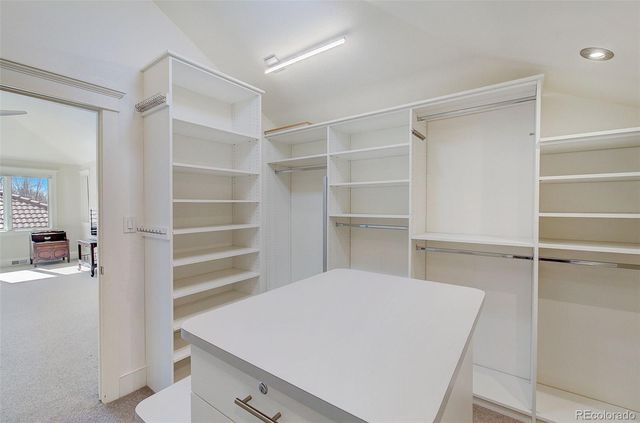 a room with a cabinets and a window