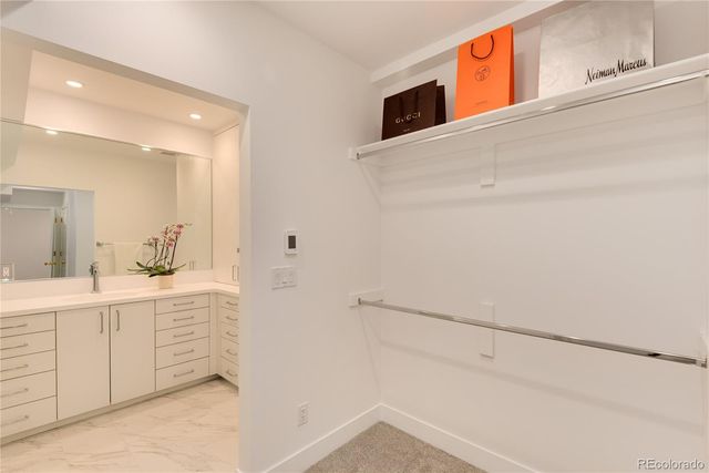 a view of an empty walk in closet