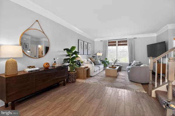 a living room with furniture fireplace and flat screen tv