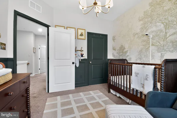 a bedroom with furniture and wooden floor