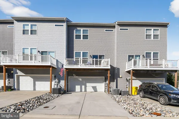 a front view of a building with parking