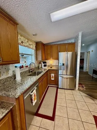 a kitchen with a stove a sink and a microwave